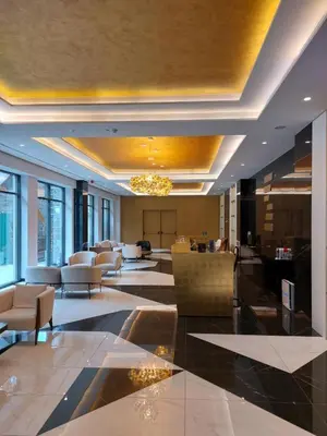 a lobby with couches and chairs in a building at Apartman Mimi Zepterme Vrnjačka Banja in Vrnjačka Banja
