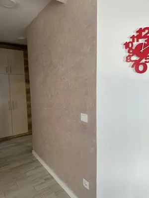 an empty room with a wall with a clock on it at Vidik Residence A23 in Kopaonik