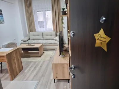 a living room with a door with a star on it at Apartmani Marjanovic in Jagodina