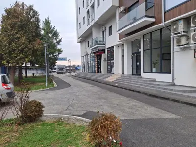 an empty street in front of a building at Apartmani Marjanovic in Jagodina