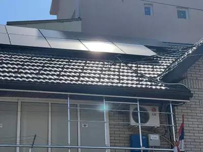 a solar panel on the roof of a building at Slobo Velickovic in Prokuplje