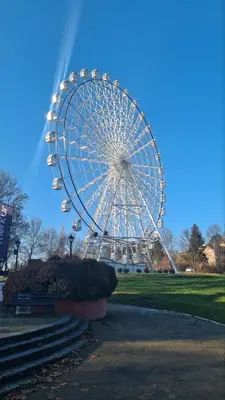 a ferris wheel in a park on a clear day at Moj Mir in Vrnjačka Banja