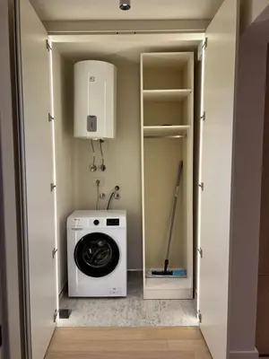 a laundry room with a washer and dryer in it at Zepterme 509 in Vrnjačka Banja