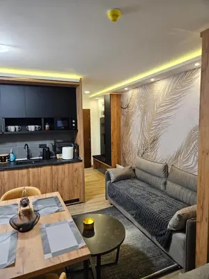 a living room with a couch and a table at Bella vista KOP in Kopaonik