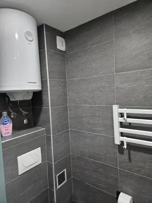 a bathroom with a shower with a toilet and a roll upounter at Bella vista KOP in Kopaonik