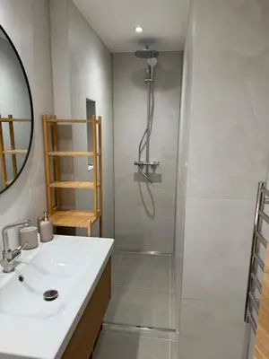 a bathroom with a shower and a sink and a shower at Juli Kop in Kopaonik