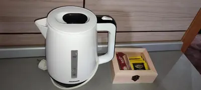a white blender sitting on a counter next to a box at Apartman LuPa in Kopaonik