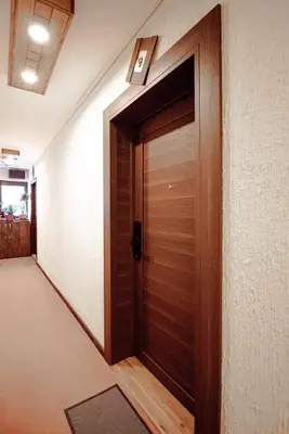 a wooden door in a hallway of a building at Apartment Spust in Kopaonik