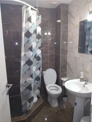 a bathroom with a toilet and a sink at Marta i Marija 2 in Vrnjačka Banja
