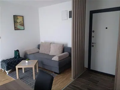a living room with a couch and a table at Marta i Marija 2 in Vrnjačka Banja