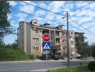 a stop sign in front of a building at Apartman Sofi in Vrnjačka Banja