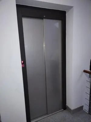 a sliding glass door in a room at Apartman Sofi in Vrnjačka Banja