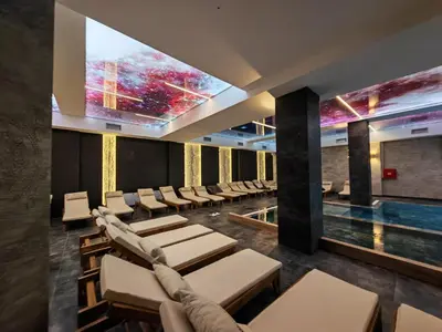 a conference room with chairs and a projection screen at Apartman Aska - Residence Hill in Kopaonik