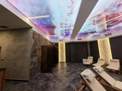 a room with a ceiling with a painting of the universe at Apartman Aska - Residence Hill in Kopaonik