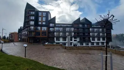 a large building with a lot of windows at Apartman Aska - Residence Hill in Kopaonik
