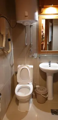 a bathroom with a toilet and a sink at Apartman Sivi Vuk Kopaonik in Kopaonik