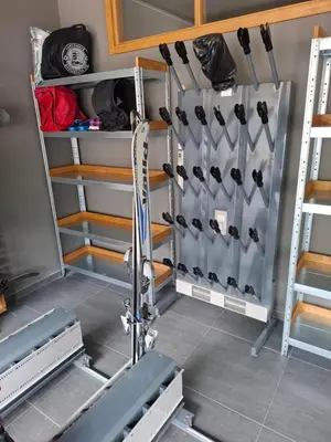 a gym room with a rack full of utensils at TomaR-Gondola in Kopaonik