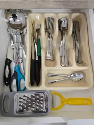 a tray filled with utensils in a drawer at Doksim Luxury Apartments 201 in Pirot