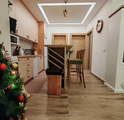 a kitchen with a christmas tree in the middle at Apartman MPS Kopaonik-Free Spa in Kopaonik