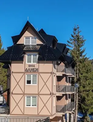 a building with solar panels on the roof at Apartman MPS Kopaonik-Free Spa in Kopaonik