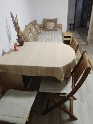 a wooden table with a bed in a room at Apartman BREG in Pirot