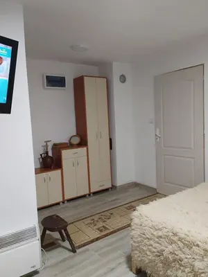 an empty bedroom with a bed and a closet at Apartman BREG in Pirot