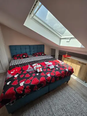 a bedroom with a bed with a large window at Doksim Luxury Apartments 301 in Pirot