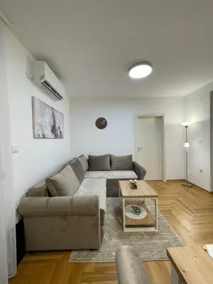 a living room with a couch and a table at Apartment Luka Lux in Vrnjačka Banja