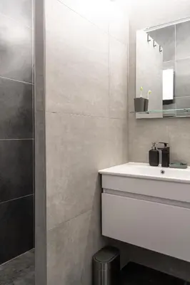 a bathroom with a white sink and a mirror at Studio Bele Staze Central in Brzeće