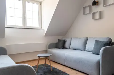 a living room with a couch and a table at Studio Bele Staze Central in Brzeće