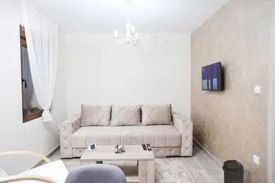 a living room with a couch and a coffee table at Alles Ski in Brzeće