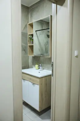 a bathroom with a sink and a mirror at Alles Ski in Brzeće