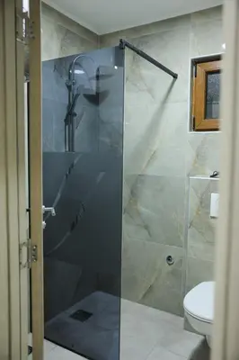 a shower with a glass door in a bathroom at Alles Ski in Brzeće