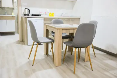 a table and four chairs in a kitchen at Alles Ski in Brzeće