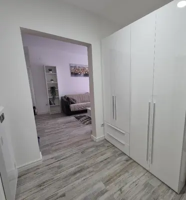 an empty living room with a large white closet at Pirotski amanet in Pirot