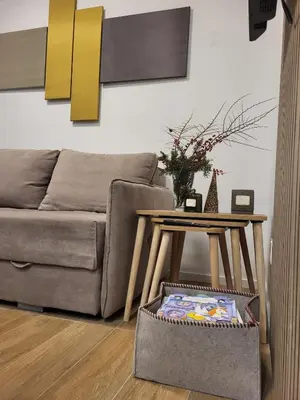 a living room with a couch and a table at Cozy Kop, Free Parking, SPA for additional price in Kopaonik