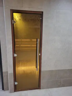 a gold elevator door in a building at Cozy Kop, Free Parking, SPA for additional price in Kopaonik