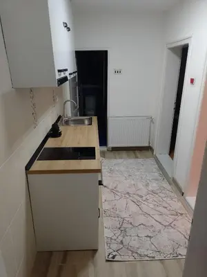 a kitchen with a sink and a counter top at Apartman Milosavljević in Železnička Stanica Ćele Kula