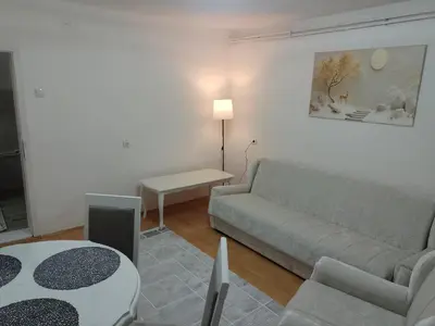a living room with a couch and a table at Apartman Milosavljević in Železnička Stanica Ćele Kula