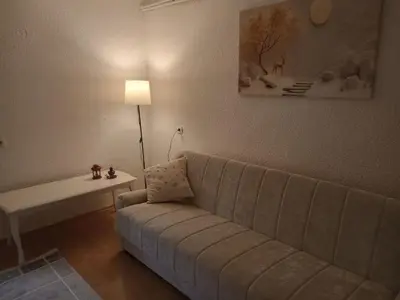 a living room with a couch and a table at Apartman Milosavljević in Železnička Stanica Ćele Kula
