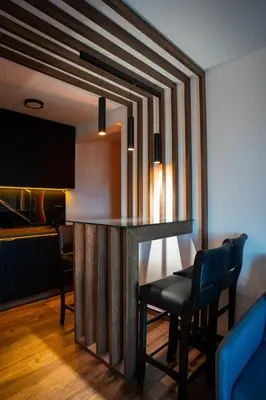 a bar in a room with chairs and a table at KonKal - Royal resort in Kopaonik