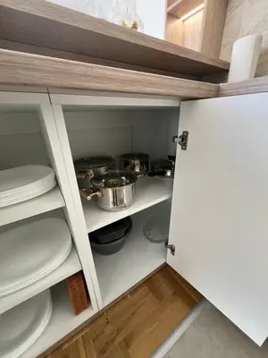 a cupboard filled with lots of pots and pans at Apartman Lux Jocić in Vrnjačka Banja