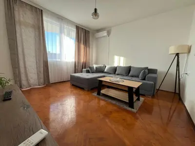 a living room with a couch and a coffee table at Apartman Stojanovic in Vranje