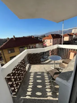 a view of a balcony with a table and a fence at Apartman Stojanovic in Vranje