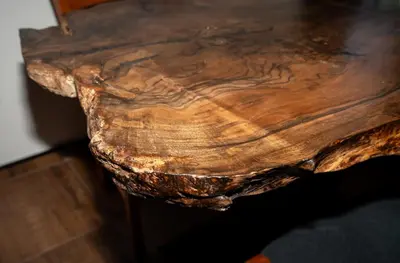 a close up of a wooden table with a tree stumpussion at KonKal - Royal resort in Kopaonik