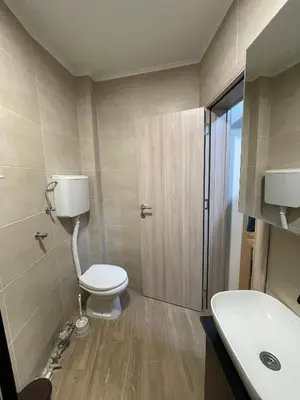 a bathroom with a toilet and a sink at Apartman 911 in Soko Banja