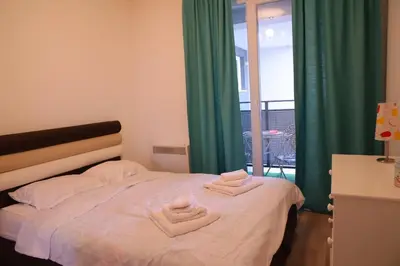 a bedroom with a bed with two towels on it at Stan na dan 2 in Paraćin
