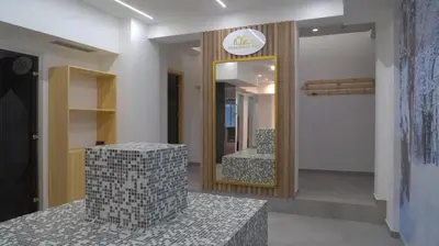 a room with a mirror and a staircase with a chair at President Kop A104 in Kopaonik