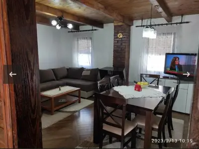 a living room with a couch and a table at Apartmani Maljković in Knjazevac.