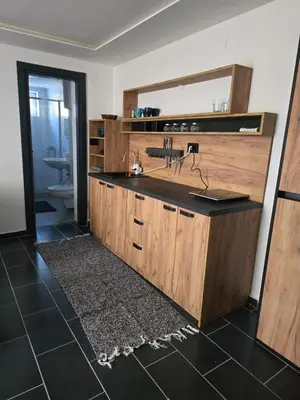 a bathroom with a sink and a mirror at Tara Apartments Kopaonik in Kopaonik